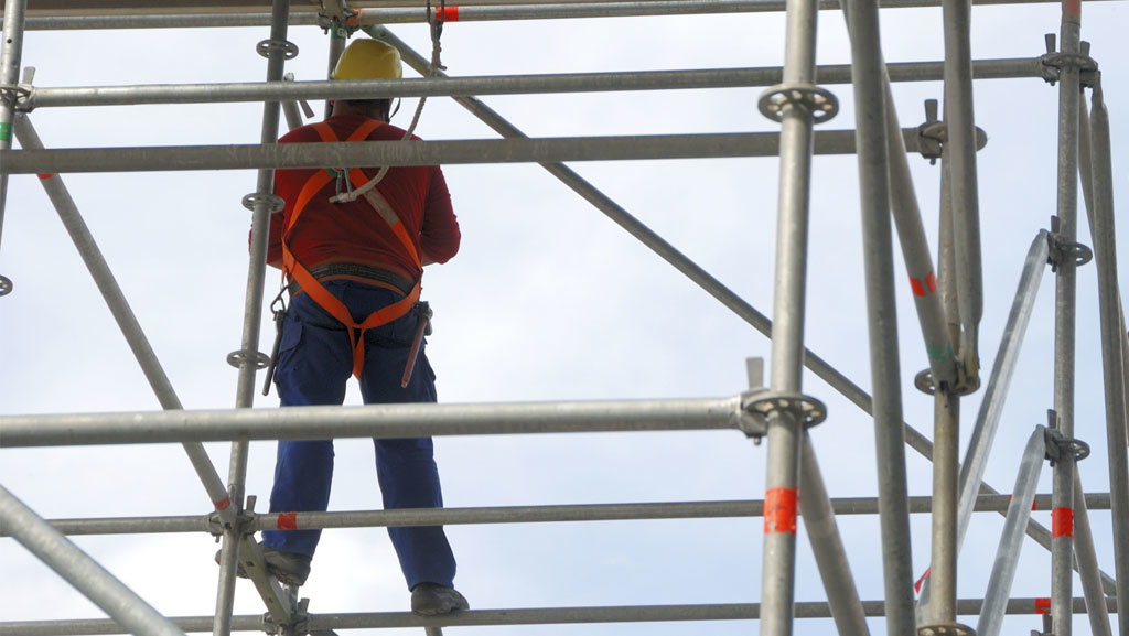 Man Standing on Scaffolding