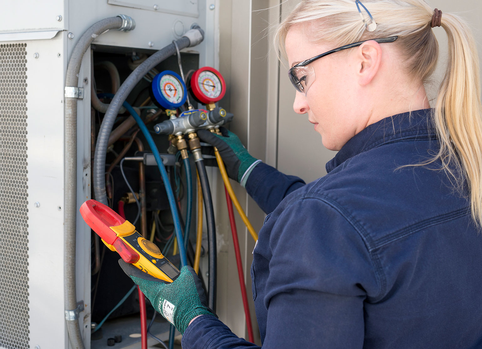 Apprentice working on rooftop equipment