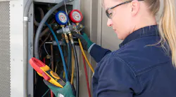 Apprentice working on rooftop equipment