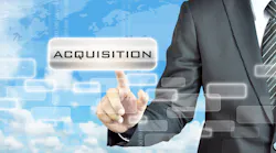 man in suit pointing at acquisition sign