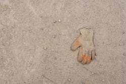work glove lying in dirt work glove lying in dirt