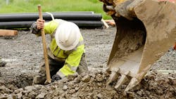 construction working digging trench construction working digging trench