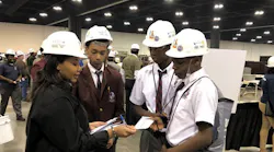 IEC coordinator Delast Muhammad with students