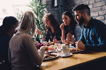 business people eating in restaurant