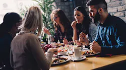 business people eating in restaurant