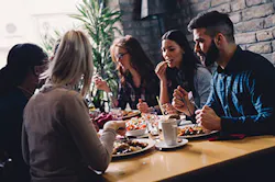 business people eating in restaurant