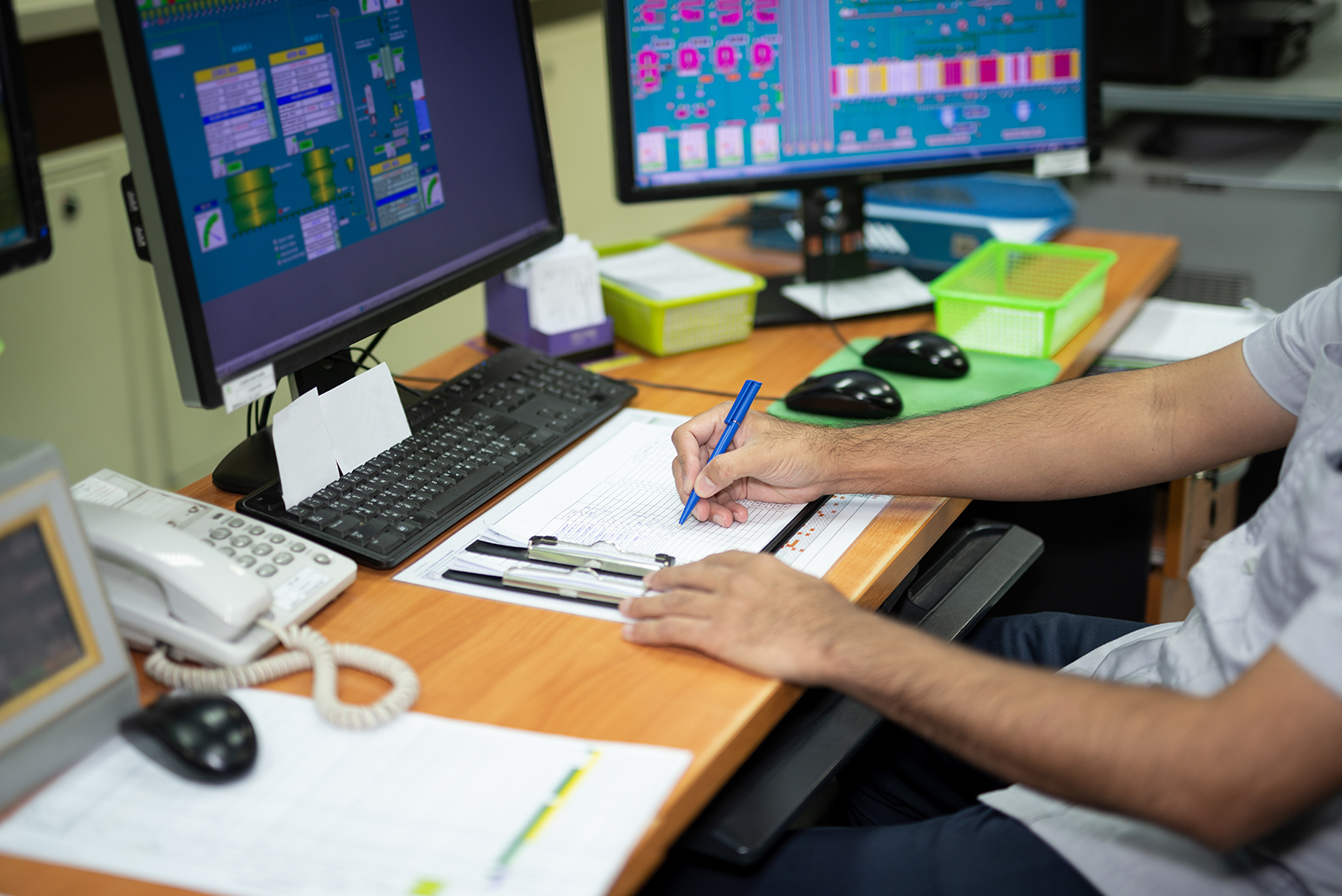 male worker in plant control room