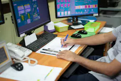 male worker in plant control room