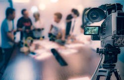 video camera filming workers video camera filming workers