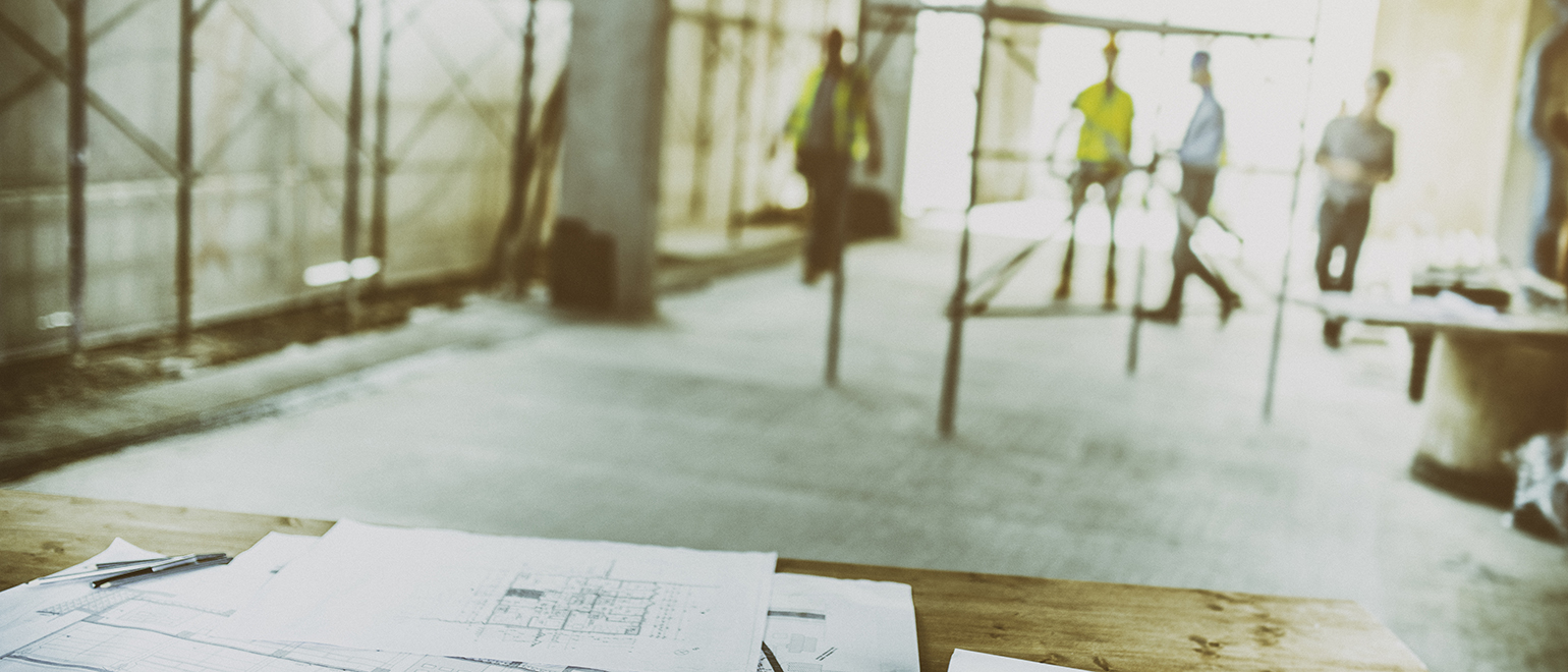 blueprints and construction workers