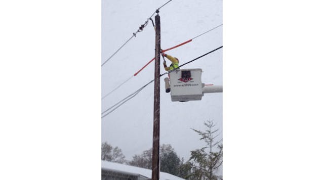 A lineman from E-J Electric Installation Co., Long Island, N.Y., works to restore power in a neighborhood hit by Hurricane Sandy.