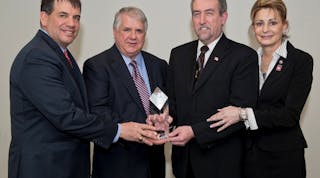 EMCOR Group, Inc. President &amp; CEO Tony Guzzi presents William (Bill) Koch Jr., senior estimator at Forest Electric NJ, with the EMCOR Diamond Award for 2012. Bill received the honor for overcoming personal tragedy and working with Hope for the Warriors. Pictured from left to right are: Tony Guzzi, president &amp; CEO, EMCOR Group, Inc.; Harry Sassaman, president, Forest Electric NJ; Bill Koch Jr.; and Bill&rsquo;s wife, Christine Koch.