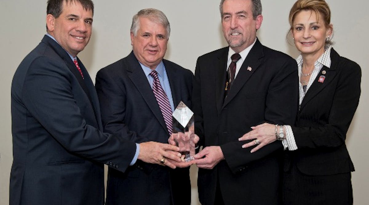 EMCOR Group, Inc. President &amp; CEO Tony Guzzi presents William (Bill) Koch Jr., senior estimator at Forest Electric NJ, with the EMCOR Diamond Award for 2012. Bill received the honor for overcoming personal tragedy and working with Hope for the Warriors. Pictured from left to right are: Tony Guzzi, president &amp; CEO, EMCOR Group, Inc.; Harry Sassaman, president, Forest Electric NJ; Bill Koch Jr.; and Bill&rsquo;s wife, Christine Koch.