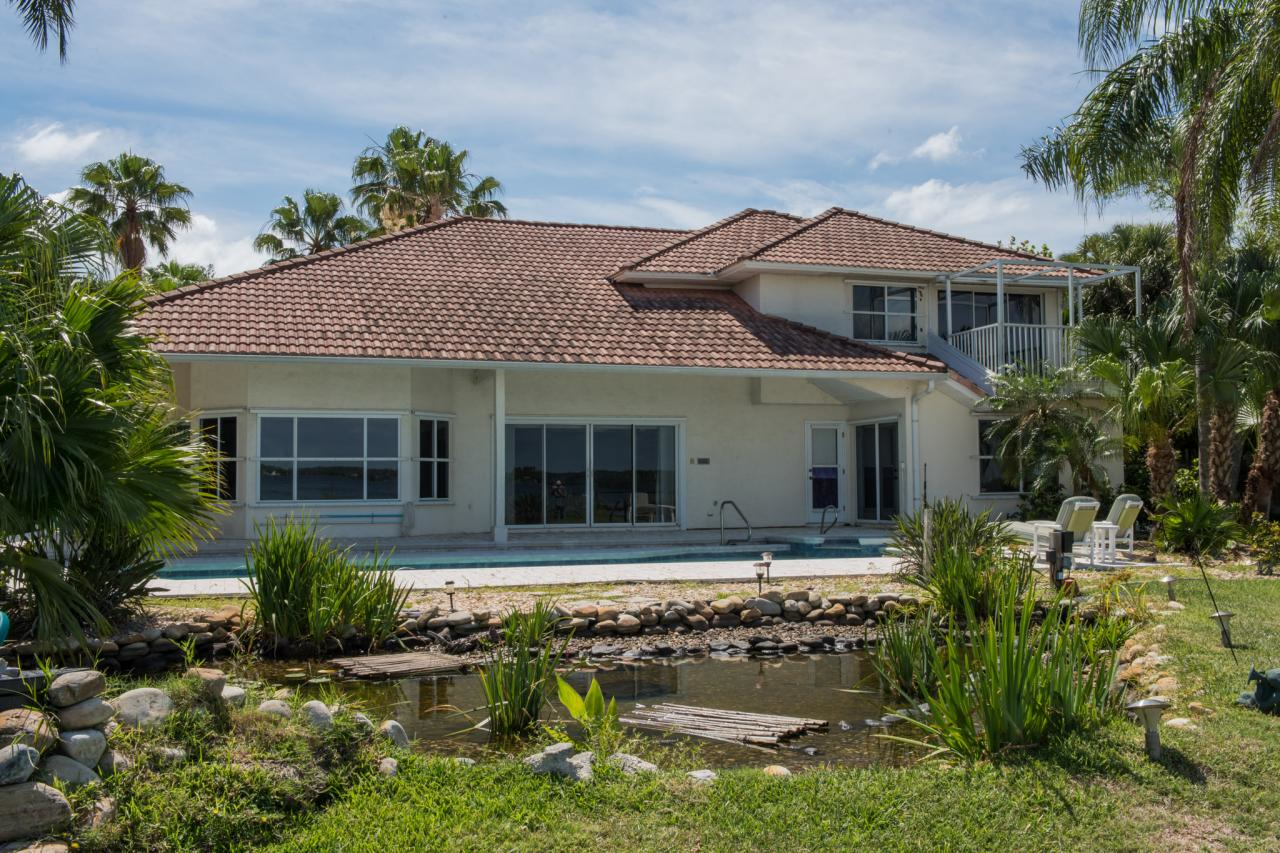 This Merritt Island home will be completely gutted and remodeled during renovations by HGTV Pictured is an exterior view of the back of the house before renovations