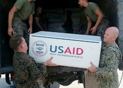 Petty Officer 1st Class Colby Wightman Right volunteered to assist in the humanitarian assistance and disaster relief efforts by loading and delivering 300 bags of beans and rice in two sorties to individuals affected by Hurricane Matthew in Jeremie Petty Officer 1st Class Colby Wightman Right volunteered to assist in the humanitarian assistance and disaster relief efforts by loading and delivering 300 bags of beans and rice in two sorties to individuals affected by Hurricane Matthew in Jeremie