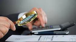 magnifying glass over documents