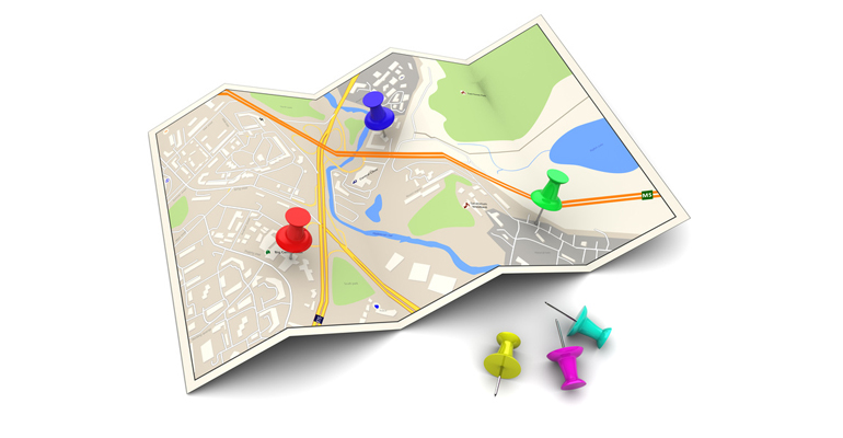 Graphic of a map with push pins.