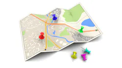 Graphic of a map with push pins.