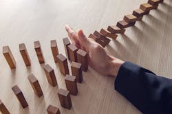 stopping domino effect oatawa iStock Getty Images Plus.jpg stopping domino effect oatawa iStock Getty Images Plus.jpg