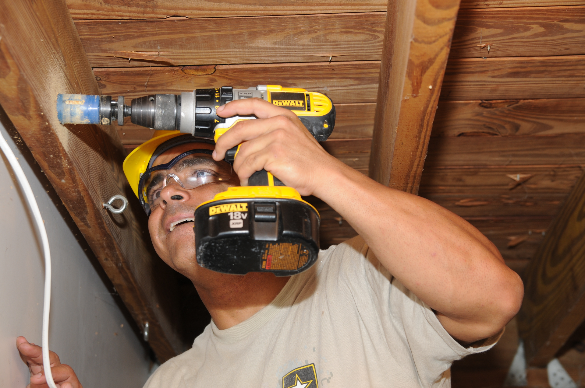 U s Army Spc Ezra Pineda An Interior Electrician With 758th Engineer Company Drills A Hole To Run Electrical Wiring During Innovative Readiness Training With Rebu 5e345b438d469