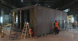 Workers assemble a hotel room module bound for Marriott’s Manhattan AC Hotel at a DMD Modular assembly facility in Skawina, Poland. Workers assemble a hotel room module bound for Marriott’s Manhattan AC Hotel at a DMD Modular assembly facility in Skawina, Poland.