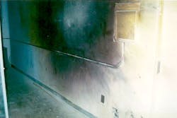 Photo 3. Plastic (carbon) and steel vaporized onto concrete wall (black and purple) opposite equipment at blast location. Copper (orange) vaporized onto wall also. Photo 3. Plastic (carbon) and steel vaporized onto concrete wall (black and purple) opposite equipment at blast location. Copper (orange) vaporized onto wall also.