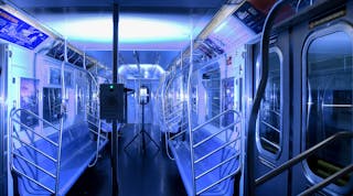 A New York City Metro Transit Authority subway car is bathed in germ-killing ultraviolet light emitted from portable and pole-based fixtures.