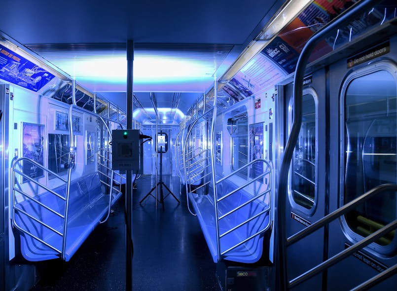 A New York City Metro Transit Authority subway car is bathed in germ-killing ultraviolet light emitted from portable and pole-based fixtures.