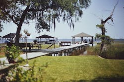Photo 1. The boat dock on the far right is where the accident occurred. The wiring to the dock is routed on the opposite side of the walkway. Photo 1. The boat dock on the far right is where the accident occurred. The wiring to the dock is routed on the opposite side of the walkway.
