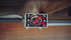 Photo 4. This image is of the under-deck plastic junction box with plastic conduits emerging on both sides. Water was released from the box when the inspector opened it. Photo 4. This image is of the under-deck plastic junction box with plastic conduits emerging on both sides. Water was released from the box when the inspector opened it.