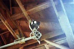 Photo 5. An image of the lift motor mounted on a metal plate, attached to the metal rod with the metal wires that are attached to the metal lift rods in Photo 2. Photo 5. An image of the lift motor mounted on a metal plate, attached to the metal rod with the metal wires that are attached to the metal lift rods in Photo 2.