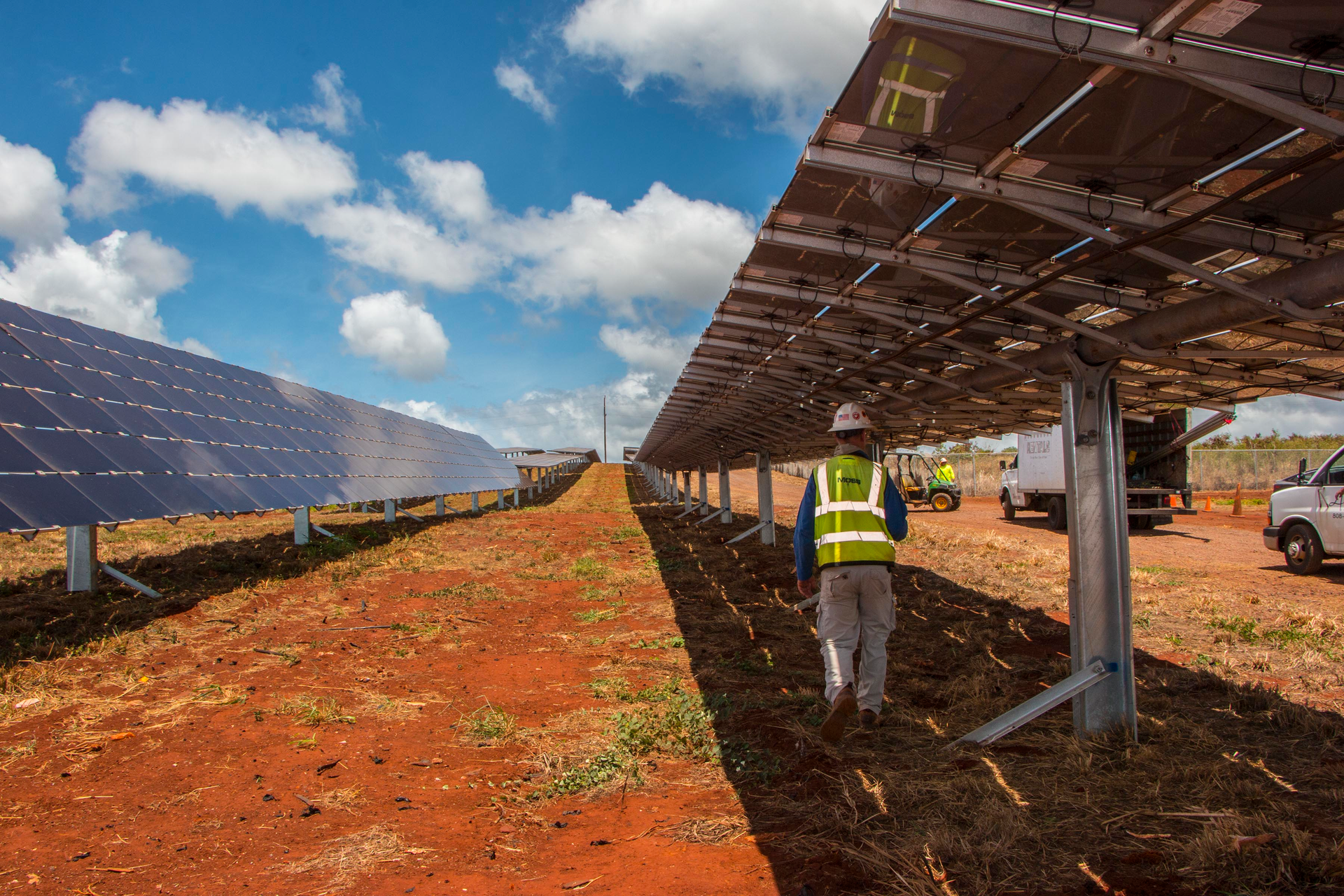 An electrician checks the connections for Clearway Energy Group&rsquo;s 49MW Kawailoa Solar project located in Oahu, Hawaii.