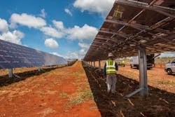 An electrician checks the connections for Clearway Energy Group’s 49MW Kawailoa Solar project located in Oahu, Hawaii. An electrician checks the connections for Clearway Energy Group’s 49MW Kawailoa Solar project located in Oahu, Hawaii.