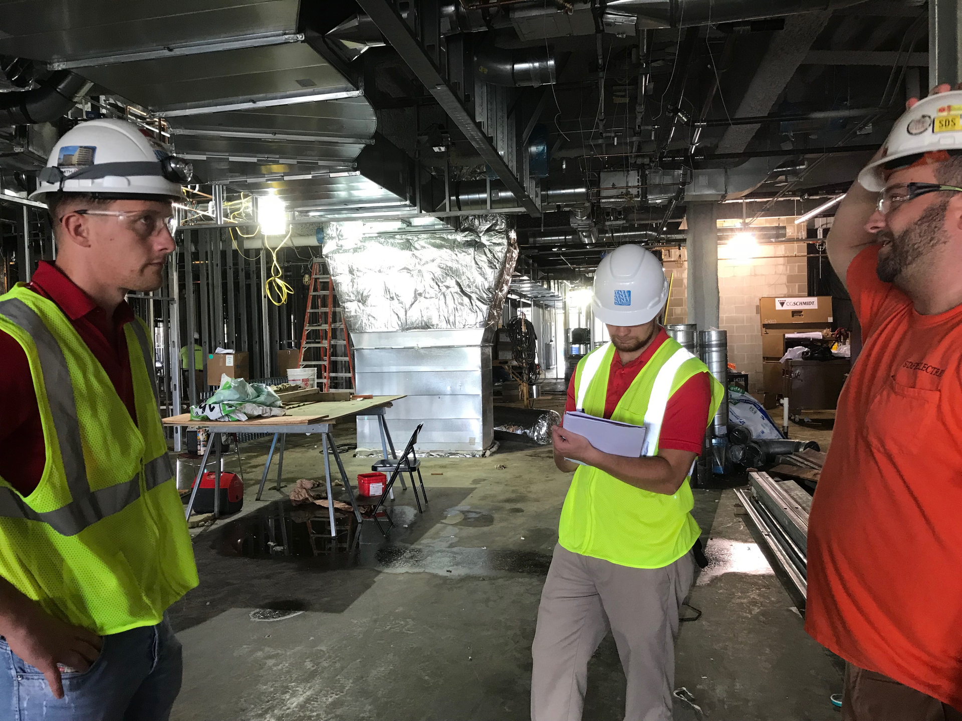 Photo 1. Collecting data through the job-site visit checklist with the foremen on-site.