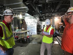 Photo 1. Collecting data through the job-site visit checklist with the foremen on-site. Photo 1. Collecting data through the job-site visit checklist with the foremen on-site.