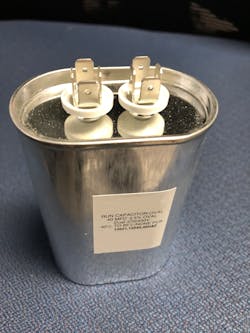 Photo 2. A typical oil-filled capacitor used for single-phase motor starting and running. Photo 2. A typical oil-filled capacitor used for single-phase motor starting and running.