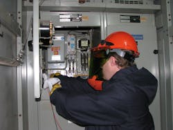 Photo 3. Testing for absence of voltage in a controlled lab session like the actual conditions the worker will be expected to work in. Photo 3. Testing for absence of voltage in a controlled lab session like the actual conditions the worker will be expected to work in.