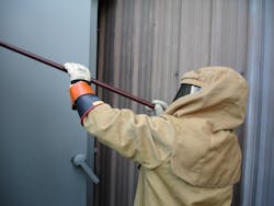 Photo 6. Testing for the absence of voltage on medium-voltage switchgear. Photo 6. Testing for the absence of voltage on medium-voltage switchgear.