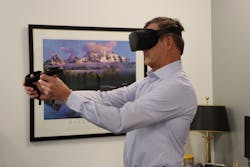 Steve Lane, PE, BCEE, FACEC, the CEO and president of Smith Seckman Reid, participates in a VR call from his office.