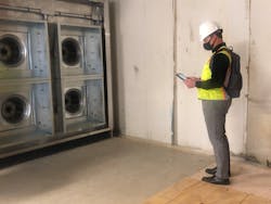 A Dewberry employee uses construction document software to track installation progress on an air-handler system at a hospital. A Dewberry employee uses construction document software to track installation progress on an air-handler system at a hospital.