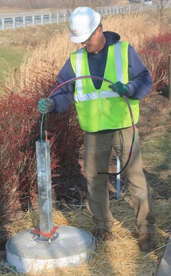 An RJP Electric worker wires the pedestal for an EV charger at a St. Charles County (Mo.) Economic Development Center property. An RJP Electric worker wires the pedestal for an EV charger at a St. Charles County (Mo.) Economic Development Center property.