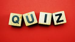 Quiz On Wooden Letters With Red Background