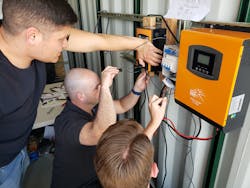Working with a solar inverter during a microgrid educational session of the Laboratory for Energy and Power Solutions at Arizona State University. Working with a solar inverter during a microgrid educational session of the Laboratory for Energy and Power Solutions at Arizona State University.