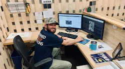 Michael Miller is coordinating the installation of a 108-panel ground-mount solar system for Standard Energy Solutions.
