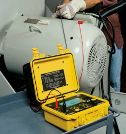 This worker is performing an insulation resistance test on a 50-hp 480V motor.