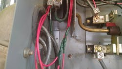 Photo 16. A closer look reveals grounding issues as well as water entering the enclosure. Photo 16. A closer look reveals grounding issues as well as water entering the enclosure.