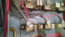 Photo 17. Notice the damaged blade on the switch and the burned wire where it crossed phases. Photo 17. Notice the damaged blade on the switch and the burned wire where it crossed phases.