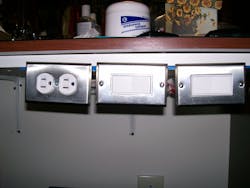 Photo 1. If you look closely between the boxes, you can see the exposed conductors. Photo 1. If you look closely between the boxes, you can see the exposed conductors.