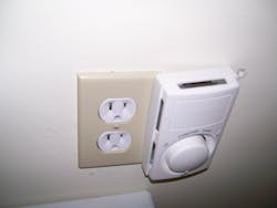 Photo 6. This thermostat didn’t sit flush against the wall, indicating some issue. Photo 6. This thermostat didn’t sit flush against the wall, indicating some issue.