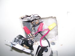 Photo 7. Removing the devices revealed the hacked apart 1-gang box and the installer&apos;s method of wiring the thermostat.